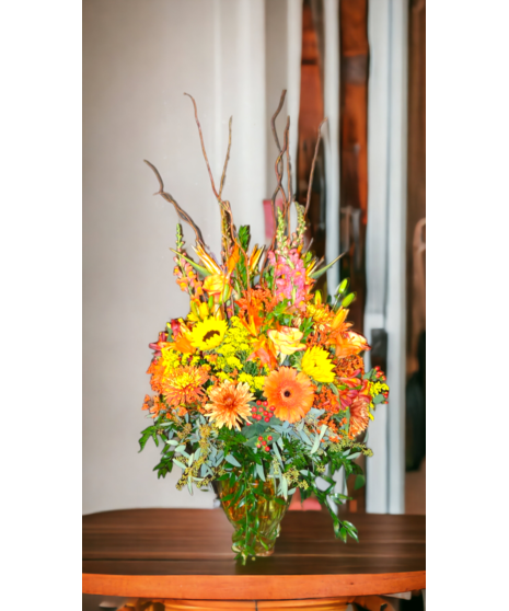 large vase filled with fall flowers