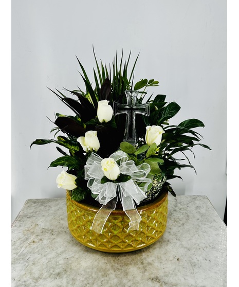 Dish garden of green and blooming plants with a keepsake crystal cross