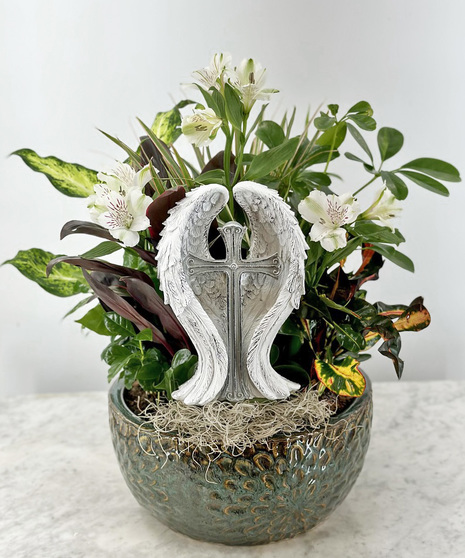 dish garden with religious statue featuring angel wings