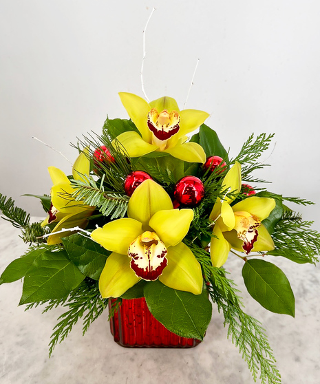 fall toned orchids in a cube