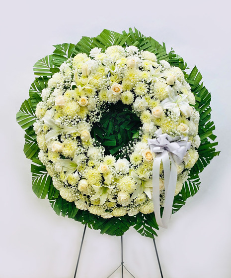 White wreath arranged by a florist in East Greenwich, RI : Busy